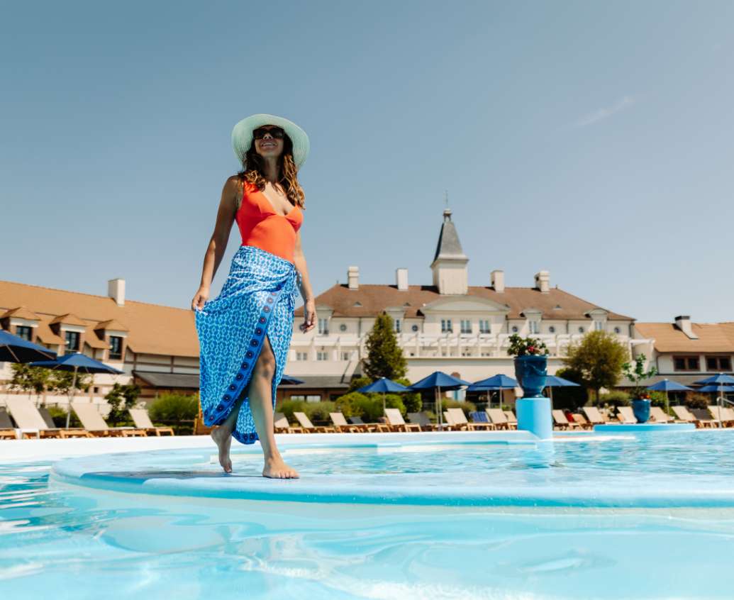 Lady enjoying the pool on vacation